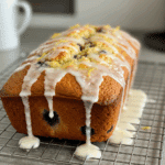 Glazed Lemon Blueberry Bread loaf with visible blueberries.