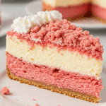 A beautiful slice of Strawberry Shortcake Cheesecake Cake ready to serve.